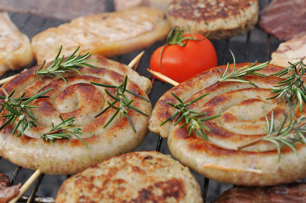 Meat cooking on the barbecue outdoors.