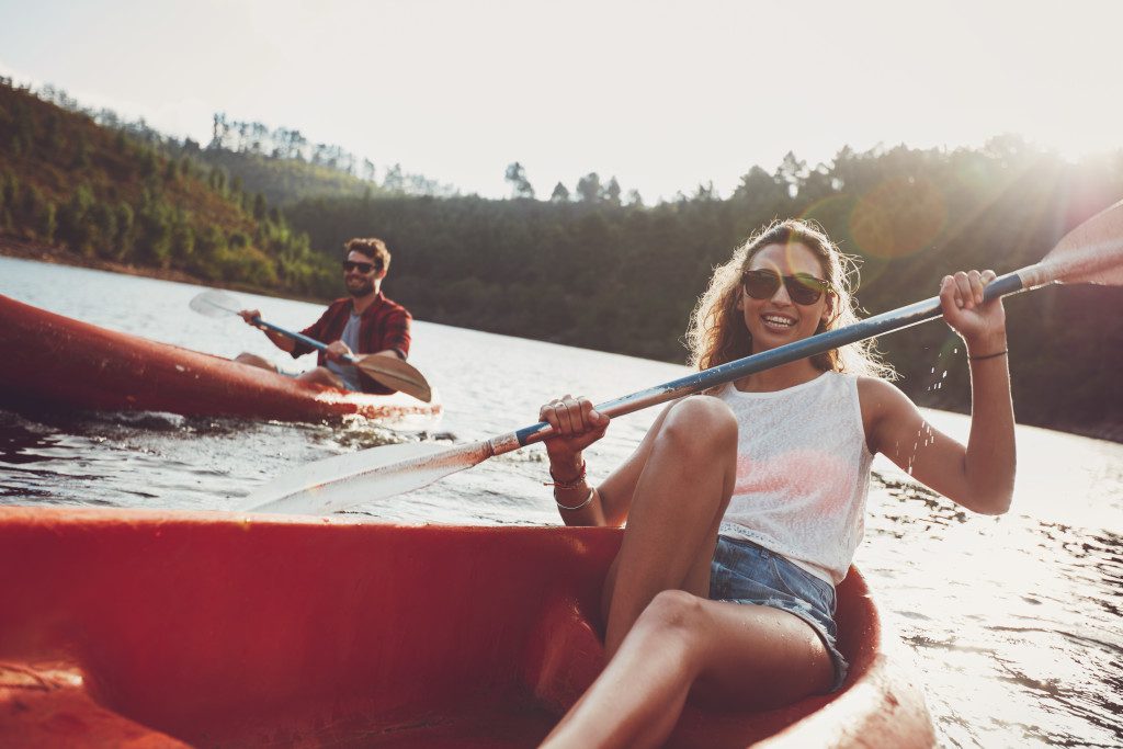 Young people canoeing in a lake