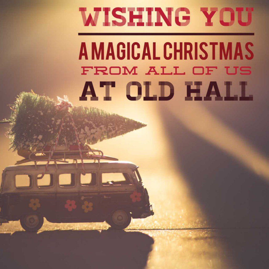 A caravan with a tree on top, text saying 'wishing you a magical Christmas from all of us at old Hall'