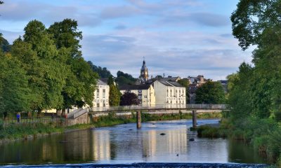 The River Kent, Kendal, Cumbria, England, with the clocktower of the Town Hall in the background