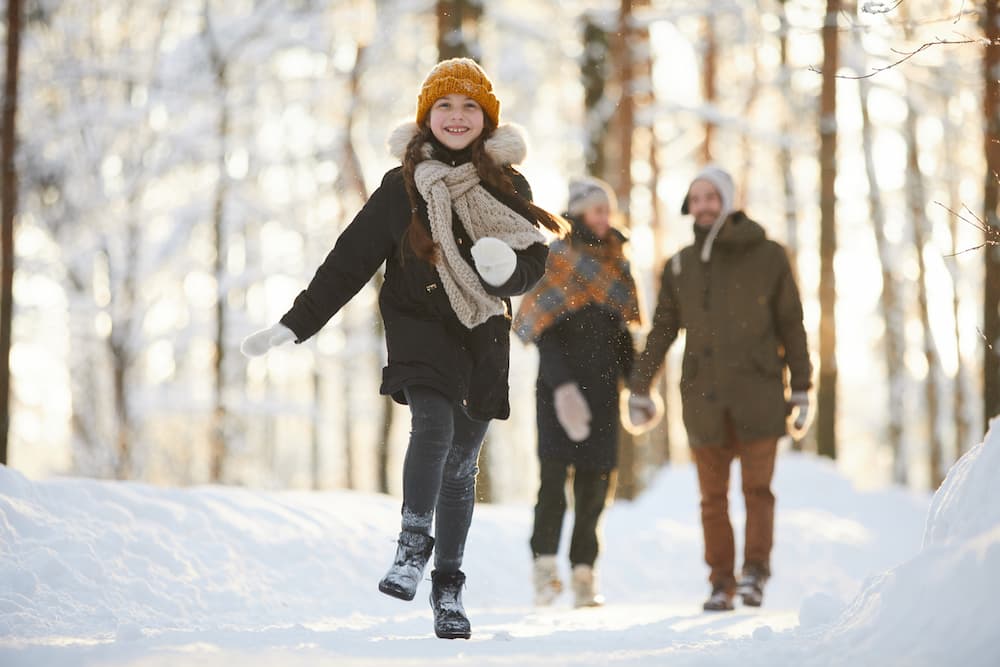 family running in snow