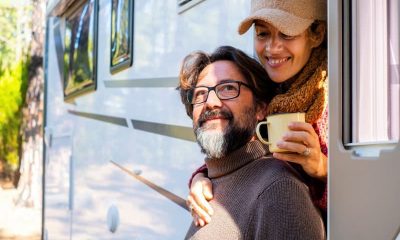 a couple enjoying a brew in a caravan